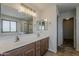 Bright bathroom with dual sinks, spacious vanity, and a glass-enclosed shower at 2408 W Saint Kateri Dr, Phoenix, AZ 85041