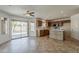 Open layout from the kitchen to the dining area, with stainless steel appliances and a view of the outdoor pool at 2408 W Saint Kateri Dr, Phoenix, AZ 85041