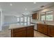 Open concept kitchen with stainless steel appliances, a breakfast bar island, and a view of the living room at 2408 W Saint Kateri Dr, Phoenix, AZ 85041
