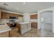 Open kitchen equipped with stainless steel appliances, an island with breakfast bar, and natural lighting at 2408 W Saint Kateri Dr, Phoenix, AZ 85041