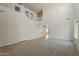 Living room showcasing soaring ceilings, a staircase with white railing, and a view into the dining room at 2408 W Saint Kateri Dr, Phoenix, AZ 85041