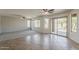 Bright living room showcasing a seamless transition into the dining area and views of the pool through sliding doors at 2408 W Saint Kateri Dr, Phoenix, AZ 85041
