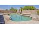 Backyard swimming pool area features a spa, rock details, and privacy wall at 2408 W Saint Kateri Dr, Phoenix, AZ 85041