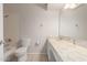 Clean bathroom featuring a bathtub, toilet, and vanity with a marble countertop at 2920 W Michigan Ave, Phoenix, AZ 85053