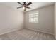 Cozy bedroom with plush carpet, neutral walls, and a window with natural light at 2920 W Michigan Ave, Phoenix, AZ 85053