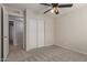 Comfortable bedroom featuring neutral walls, plush carpet, and a closet for storage at 2920 W Michigan Ave, Phoenix, AZ 85053