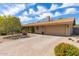 Charming single-story home with a brick driveway, attached garage, and mature landscaping at 2920 W Michigan Ave, Phoenix, AZ 85053