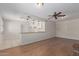 Open floor plan with wood floors flowing into the kitchen and living area, featuring a brick fireplace at 2920 W Michigan Ave, Phoenix, AZ 85053