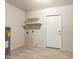 Utility room with shelving and laminate wood flooring at 2920 W Michigan Ave, Phoenix, AZ 85053