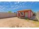 Enclosed backyard with a small building and a wall, great for outdoor activities at 2936 E Willetta St, Phoenix, AZ 85008