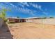 View of the home's rear exterior from the spacious dirt backyard at 2936 E Willetta St, Phoenix, AZ 85008