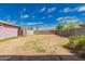 Spacious dirt backyard surrounded by block fencing, offering privacy and potential for landscaping at 2936 E Willetta St, Phoenix, AZ 85008