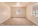 Bright bedroom with tile flooring and large window at 2936 E Willetta St, Phoenix, AZ 85008