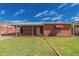 Charming brick home with a well-maintained lawn and covered parking at 2936 E Willetta St, Phoenix, AZ 85008