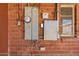 Exterior of home with meter and utilities on brick wall at 2936 E Willetta St, Phoenix, AZ 85008