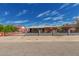 Charming single-story brick home featuring a manicured front yard and decorative wrought iron fencing at 2936 E Willetta St, Phoenix, AZ 85008