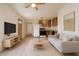 Open-concept living space with combined kitchen, creating a seamless flow perfect for modern living at 2936 E Willetta St, Phoenix, AZ 85008