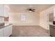 Open living room and kitchen area featuring tile floor and ceiling fan at 2936 E Willetta St, Phoenix, AZ 85008