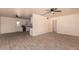 Open concept living area with a ceiling fan, easy access to the kitchen, and tile floors at 2936 E Willetta St, Phoenix, AZ 85008
