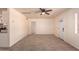 Spacious living area with a ceiling fan and direct access to the kitchen and front door at 2936 E Willetta St, Phoenix, AZ 85008