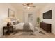 Restful bedroom with a large window, and contemporary decor offering a serene atmosphere for relaxation at 2936 E Willetta St, Phoenix, AZ 85008