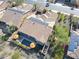 Aerial view of a home showcasing the solar panels, pool, landscaped backyard, and covered patio at 29749 N 130Th Dr, Peoria, AZ 85383