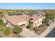 Beautiful home with solar panels, desert landscaping, a paved driveway, and a two-car garage at 29749 N 130Th Dr, Peoria, AZ 85383