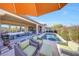 Inviting backyard with a private pool, covered patio, and comfortable lounge area at 29749 N 130Th Dr, Peoria, AZ 85383