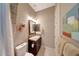 Well-lit powder room features a modern vanity and decorative accents at 29749 N 130Th Dr, Peoria, AZ 85383