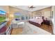Inviting bedroom with a ceiling fan and expansive views of the outdoor area at 29749 N 130Th Dr, Peoria, AZ 85383
