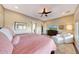 Comfortable bedroom with ceiling fan and ample natural light at 29749 N 130Th Dr, Peoria, AZ 85383
