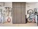 Spacious garage featuring custom storage cabinets, slat wall organizer and bicycle racks at 29749 N 130Th Dr, Peoria, AZ 85383