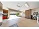 Large garage with storage cabinets, high ceilings, an insulated door, and epoxy floors at 29749 N 130Th Dr, Peoria, AZ 85383