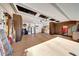 Spacious garage with ample storage, overhead lighting, epoxy flooring, and a stainless steel refrigerator at 29749 N 130Th Dr, Peoria, AZ 85383