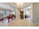 Spacious living area with beautiful floors, piano, and lots of natural light at 29749 N 130Th Dr, Peoria, AZ 85383