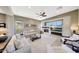 Open-concept living room featuring a fireplace and a neutral color palette at 29749 N 130Th Dr, Peoria, AZ 85383
