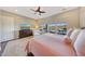 Primary bedroom featuring back patio views, light-filled windows, and comfortable lounging at 29749 N 130Th Dr, Peoria, AZ 85383