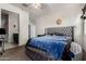 Comfortable bedroom with a luxurious round upholstered bed and a walk-in closet at 29809 W Columbus Ave, Buckeye, AZ 85396