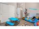 room with blue play table, a single bed and toys at 29809 W Columbus Ave, Buckeye, AZ 85396