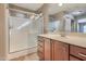 Primary bathroom features a glass-enclosed shower and a wood vanity with sink at 2994 E Megan St, Gilbert, AZ 85295
