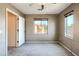 Bedroom with multiple windows that provide natural light, neutral walls, carpet and an open doorway at 2994 E Megan St, Gilbert, AZ 85295