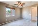 Bedroom featuring carpet, ceiling fan, and a window with natural light at 2994 E Megan St, Gilbert, AZ 85295