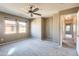 Bright bedroom with ceiling fan and two large windows offering neighborhood views at 2994 E Megan St, Gilbert, AZ 85295