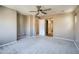Spacious bedroom featuring neutral walls, carpet, and ceiling fan at 2994 E Megan St, Gilbert, AZ 85295