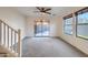 Bright living room with neutral carpet, ceiling fan, and access to the backyard at 2994 E Megan St, Gilbert, AZ 85295