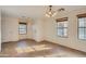 Open-concept living room with tile flooring, neutral paint, and ample natural light at 2994 E Megan St, Gilbert, AZ 85295
