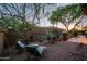 Backyard featuring seating area, mature trees, and a gravel ground cover at 32472 N 68Th Pl, Scottsdale, AZ 85266