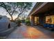 Inviting backyard features a covered patio, outdoor seating and stucco fireplace at 32472 N 68Th Pl, Scottsdale, AZ 85266