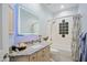 Bright bathroom with a shower and tub combination, granite countertops, and lighted mirror at 32472 N 68Th Pl, Scottsdale, AZ 85266