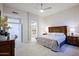 Light-filled bedroom with tile flooring and a view of the backyard at 32472 N 68Th Pl, Scottsdale, AZ 85266